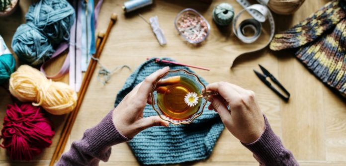 aerial-view-of-hands-holding-tea-cup-with-P2HR8ZX-e1570646421896-1014x487